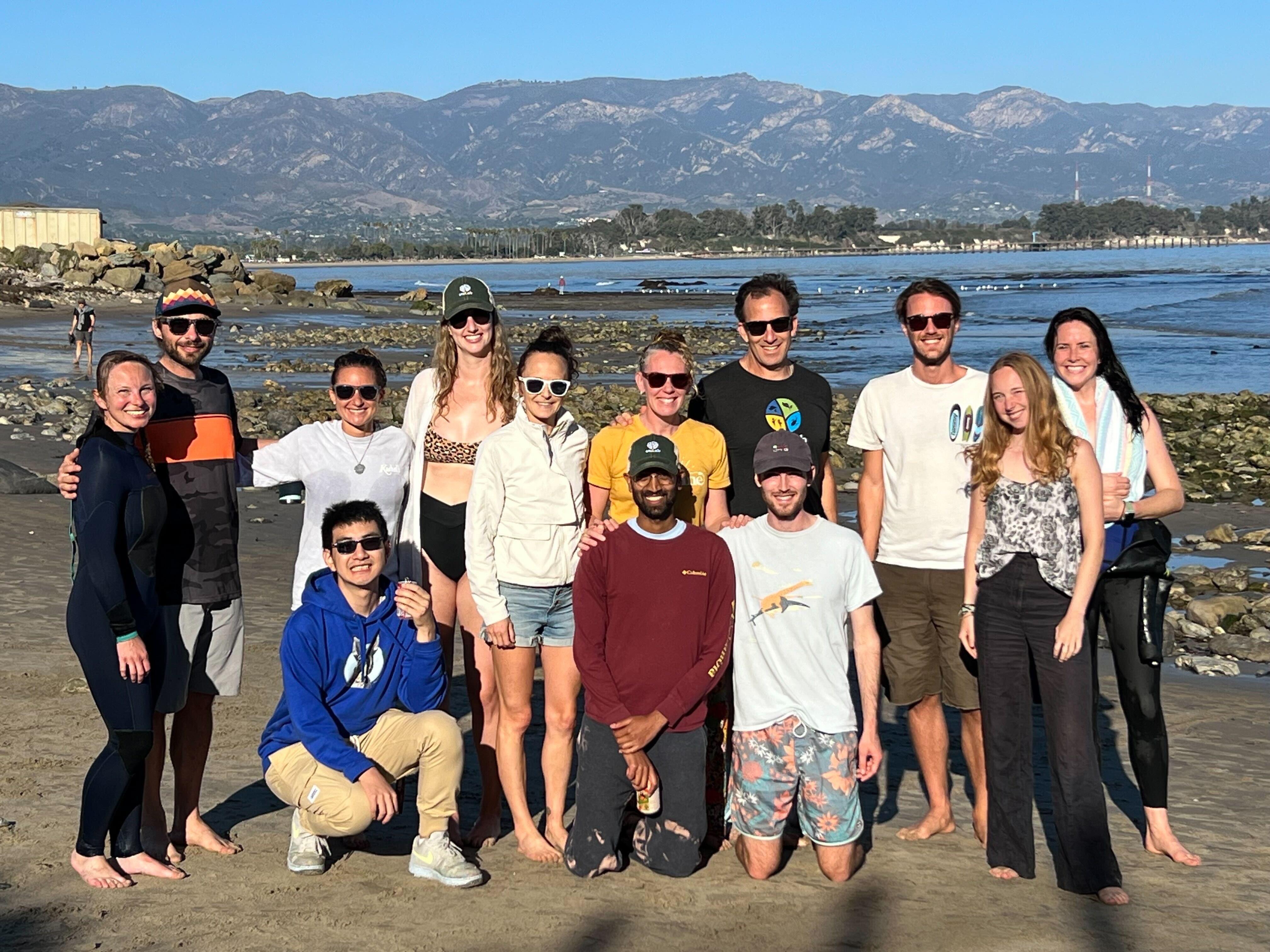 emLab team at the beach with mountains in the background