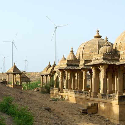 wind turbines in background of historic site in Jaisalmer, Rajasthan