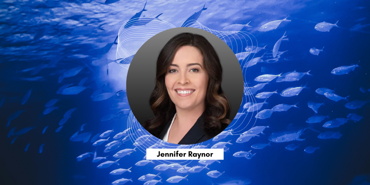 headshot of jen with fish in background