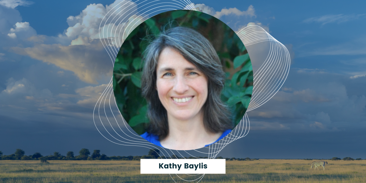 kathy baylis headshot with field in the background