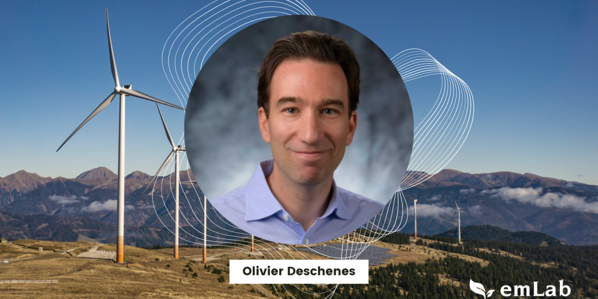 olivier deschenese headshot over wind turbines