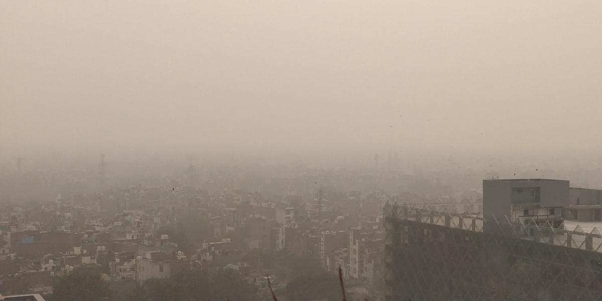 landscape photo of city and thick smog above