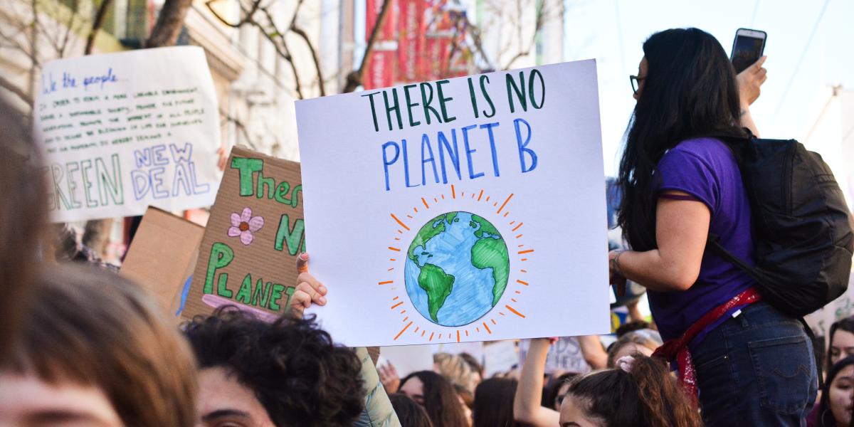 a protest sign that reads "there is no planet B"