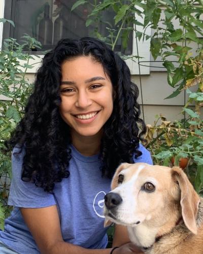 Alyssa Jain headshot with her dog