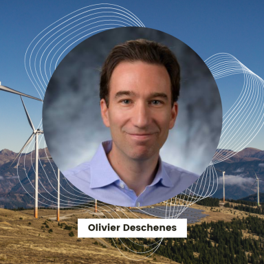 olivier deschenese headshot over wind turbines